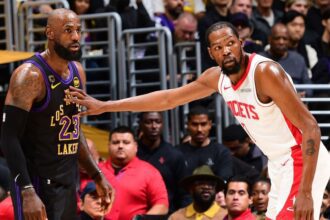 LOS ANGELES, CA - APRIL 21: LeBron James #23 of the Los Angeles Lakers and Kevin Durant #7 of the Houston Rockets look on during Round One Game Two of the 2026 NBA Playoffs on April 21, 2026 at Crypto.Com Arena in Los Angeles, California. (Photo by Adam Pantozzi/NBAE via Getty Images)