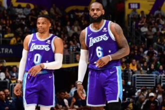 LOS ANGELES, CA - APRIL 1: Russel Westbrook #0 and LeBron James #6 of the Los Angeles Lakers look on during the game against the New Orleans Pelicans on April 1, 2022 at Crypto.Com Arena in Los Angeles, California. (Photo by Adam Pantozzi/NBAE via Getty Images)