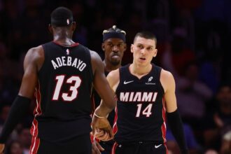 Nov 4, 2024; Miami, Florida, USA; Miami Heat guard Tyler Herro (14) celebrates with Miami Heat center Bam Adebayo (13) after scoring against the Sacramento Kings during the fourth quarter at Kaseya Center. Mandatory Credit: Sam Navarro-Imagn Images