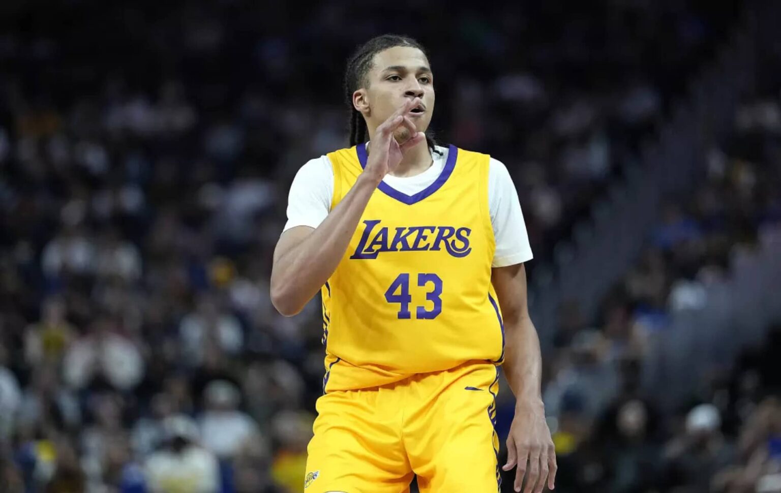 Lakers rookie Cameron Carr celebrates after making a three-pointer against Golden State in an NBA summer league game on Friday night. Credit: Thearon W. Henderson / Getty Images
