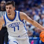 Kerr Kriisa #77 of the Kentucky Wildcats brings the ball up court during the game against the Wright State Raiders at Rupp Arena on November 4, 2024, in Lexington, Kentucky.