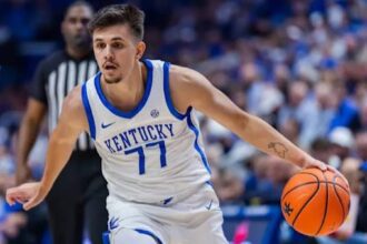 Kerr Kriisa #77 of the Kentucky Wildcats brings the ball up court during the game against the Wright State Raiders at Rupp Arena on November 4, 2024, in Lexington, Kentucky.