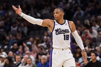 Nov 5, 2025; Sacramento, California, USA; Sacramento Kings guard Russell Westbrook (18) celebrates after scoring against the Golden State Warriors during the second quarter at Golden 1 Center. Mandatory Credit: Ed Szczepanski-Imagn Images