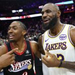 Dec 7, 2025; Philadelphia, Pennsylvania, USA; Los Angeles Lakers forward Lebron James (23) and Philadelphia 76ers guard Tyrese Maxey react with each other after the game at Xfinity Mobile Arena. Mandatory Credit: Bill Streicher-Imagn Images