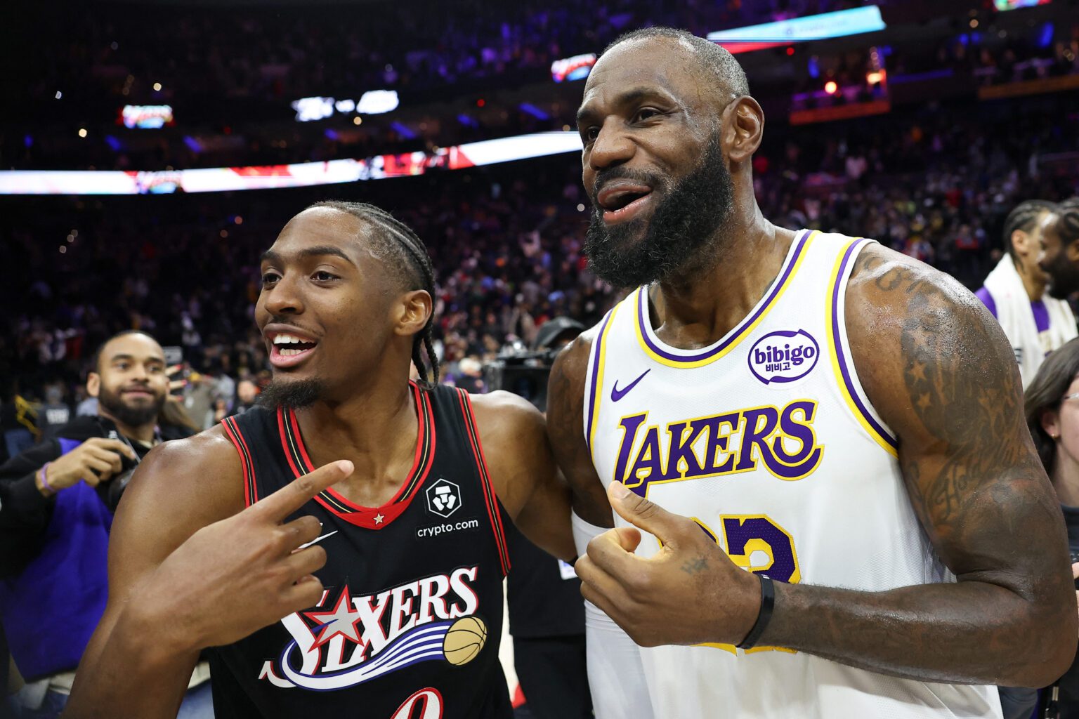 Dec 7, 2025; Philadelphia, Pennsylvania, USA; Los Angeles Lakers forward Lebron James (23) and Philadelphia 76ers guard Tyrese Maxey react with each other after the game at Xfinity Mobile Arena. Mandatory Credit: Bill Streicher-Imagn Images