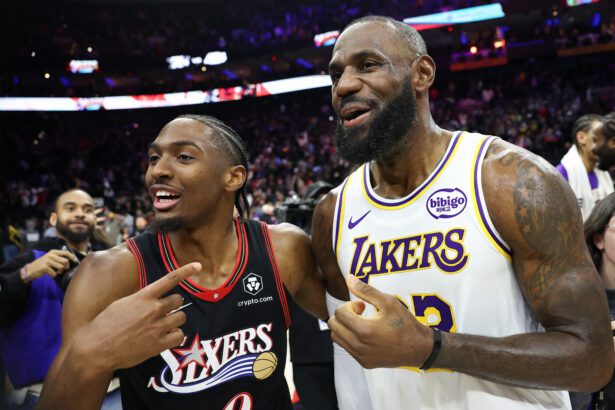 Dec 7, 2025; Philadelphia, Pennsylvania, USA; Los Angeles Lakers forward Lebron James (23) and Philadelphia 76ers guard Tyrese Maxey react with each other after the game at Xfinity Mobile Arena. Mandatory Credit: Bill Streicher-Imagn Images
