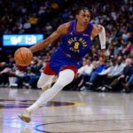 Feb 1, 2026; Denver, Colorado, USA; Denver Nuggets guard Peyton Watson (8) controls the ball in the third quarter against the Oklahoma City Thunder at Ball Arena. Mandatory Credit: Isaiah J. Downing-Imagn Images