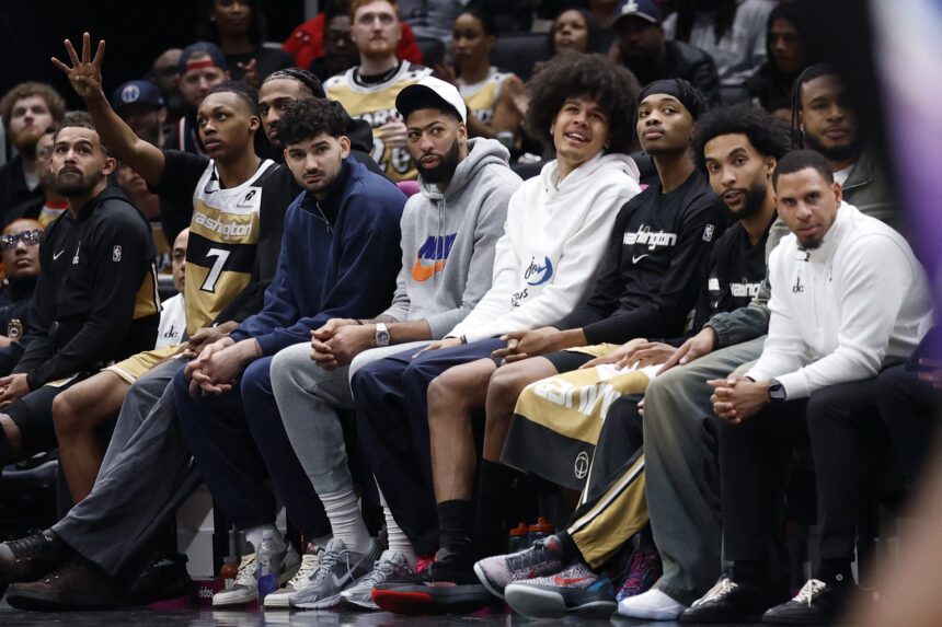 Mar 5, 2026; Washington, District of Columbia, USA; Injured Washington Wizards forward Anthony Davis (M) watches from the bench against the Utah Jazz in the first halfat Capital One Arena. Mandatory Credit: Geoff Burke-Imagn Images