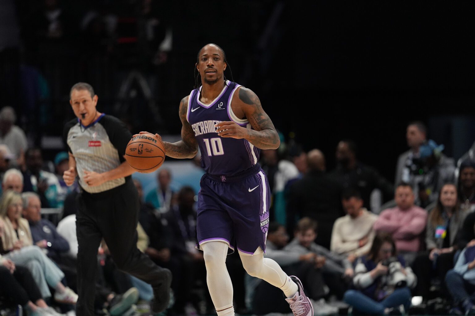 Mar 24, 2026; Charlotte, North Carolina, USA; Sacramento Kings guard/forward DeMar DeRozan (10) brings the ball up court against the Charlotte Hornets during the first quarter at Spectrum Center. Mandatory Credit: Jim Dedmon-Imagn Images