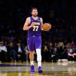 Mar 27, 2026; Los Angeles, California, USA; Los Angeles Lakers guard Luka Doncic (77) controls the ball during the second half against the Brooklyn Nets at Crypto.com Arena. Mandatory Credit: William Liang-Imagn Images