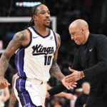 Apr 1, 2026; Toronto, Ontario, CAN; Sacramento Kings forward DeMar DeRozan (10) slaps hands with head coach Doug Christie after making a three-point basket against the Toronto Raptors in the second half at Scotiabank Arena. Mandatory Credit: Dan Hamilton-Imagn Images