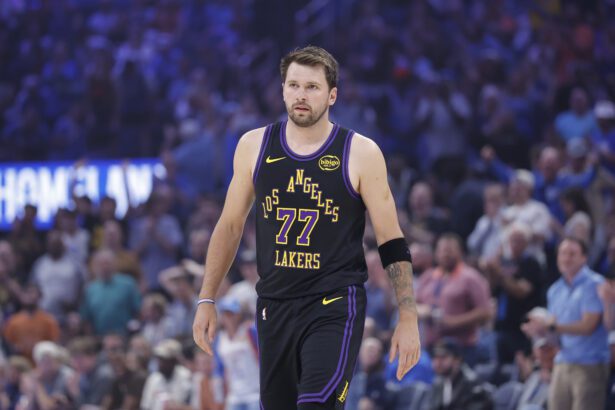 Apr 2, 2026; Oklahoma City, Oklahoma, USA; Los Angeles Lakers guard Luka Doncic (77) walks across the court during the first quarter against the Oklahoma City Thunder at Paycom Center. Mandatory Credit: Alonzo Adams-Imagn Images