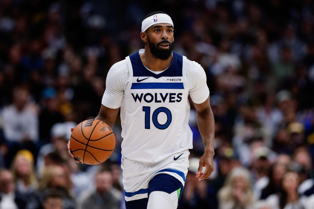 Apr 27, 2026; Denver, Colorado, USA; Minnesota Timberwolves guard Mike Conley (10) dribbles the ball up court in the first quarter against the Denver Nuggets during game five of the first round of the 2026 NBA Playoffs at Ball Arena. Mandatory Credit: Isaiah J. Downing-Imagn Images