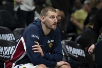 Apr 30, 2026; Minneapolis, Minnesota, USA; Denver Nuggets center Nikola Jokic (15) seats on the bench before the second half begins against the Minnesota Timberwolves during game six of the first round of the 2026 NBA Playoffs at Target Center. Mandatory Credit: Jesse Johnson-Imagn Images