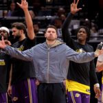May 1, 2026; Houston, Texas, USA; Los Angeles Lakers guard Luka Doncic (77, middle) reacts after a made basket against the Houston Rockets during the fourth quarter of game six of the first round of the 2026 NBA Playoffs at Toyota Center. Mandatory Credit: Erik Williams-Imagn Images
