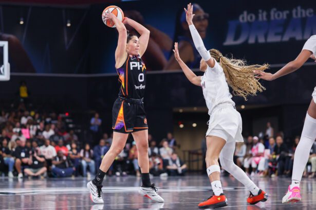 Kelsey Plum Accidentally Bear-Hugs Rival Coach And Goes Viral Instantly
