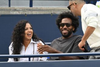 Aug 11, 2026; Toronto, Ontario, Canada; Los Angeles Clippers forward Kawhi Leonard (center) and his partner Kishele Shipley enjoy a light moment with a fan as they watch Naomi Osaka (JPN) play Elena Rybakina (KAZ) during quarter final play at Sobeys Stadium. Mandatory Credit: Dan Hamilton-Imagn Images