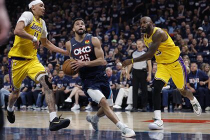May 7, 2026; Oklahoma City, Oklahoma, USA; Oklahoma City Thunder guard Ajay Mitchell (25) drives between Los Angeles Lakers center Jaxson Hayes (11) and forward LeBron James (23) in the second half during game two of the second round of the 2026 NBA Playoffs at Paycom Center. Mandatory Credit: Alonzo Adams-Imagn Images