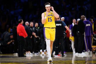 Mar 14, 2026; Los Angeles, California, USA; Los Angeles Lakers guard Austin Reaves (15) gestures during the second half against the Denver Nuggets at Crypto.com Arena. Mandatory Credit: William Liang-Imagn Images