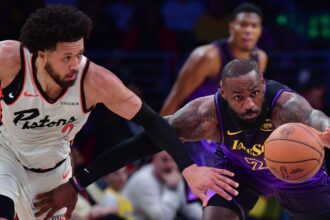 Dec 23, 2024; Los Angeles, California, USA; Los Angeles Lakers forward LeBron James (23) plays for the ball against Detroit Pistons guard Cade Cunningham (2) during the first half at Crypto.com Arena. Mandatory Credit: Gary A. Vasquez-Imagn Images