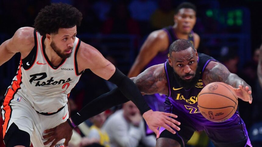 Dec 23, 2024; Los Angeles, California, USA; Los Angeles Lakers forward LeBron James (23) plays for the ball against Detroit Pistons guard Cade Cunningham (2) during the first half at Crypto.com Arena. Mandatory Credit: Gary A. Vasquez-Imagn Images