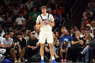 Apr 8, 2026; Phoenix, Arizona, USA; Dallas Mavericks forward Cooper Flagg (32) against the Phoenix Suns at Mortgage Matchup Center. Mandatory Credit: Mark J. Rebilas-Imagn Images