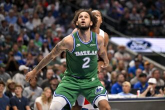 Oct 26, 2025; Dallas, Texas, USA; Dallas Mavericks center Dereck Lively II (2) looks for the ball during the game between the Mavericks and the Raptors at the American Airlines Center. Mandatory Credit: Jerome Miron-Imagn Images