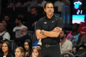 Apr 4, 2026; Miami, Florida, USA; Miami Heat head coach Erik Spoelstra keeps an eye on his team during the first half against the Washington Wizards at Kaseya Center. Mandatory Credit Jim Rassol-Imagn Images