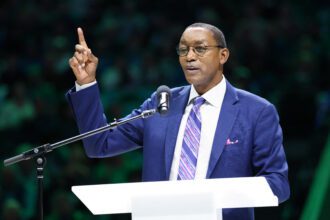 Detroit Pistons former player Isiah Thomas speaks at the retirement ceremony of Dallas Mavericks former player Mark Aguirre at halftime of teh game against the Charlotte Hornets at American Airlines Center.
