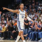 Oct 25, 2025; Memphis, Tennessee, USA; Memphis Grizzlies guard Ja Morant (12) reacts after a made basket against the Indiana Pacers during the first half at FedExForum. Mandatory Credit: Wesley Hale-Imagn Images