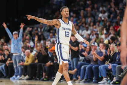 Oct 25, 2025; Memphis, Tennessee, USA; Memphis Grizzlies guard Ja Morant (12) reacts after a made basket against the Indiana Pacers during the first half at FedExForum. Mandatory Credit: Wesley Hale-Imagn Images