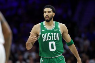 Boston Celtics forward Jayson Tatum (0) reacts to his score against the Philadelphia 76ers during the second quarter at Xfinity Mobile Arena.