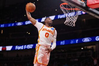 Mar 1, 2026; Atlanta, Georgia, USA; Atlanta Hawks forward Jonathan Kuminga (0) dunks against the Portland Trail Blazers in the fourth quarter at State Farm Arena. Mandatory Credit: Brett Davis-Imagn Images