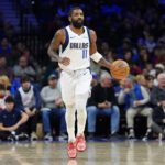 Feb 4, 2025; Philadelphia, Pennsylvania, USA; Dallas Mavericks guard Kyrie Irving (11) controls the ball against the Philadelphia 76ers in the first quarter at Wells Fargo Center. Mandatory Credit: Kyle Ross-Imagn Images