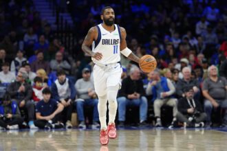 Feb 4, 2025; Philadelphia, Pennsylvania, USA; Dallas Mavericks guard Kyrie Irving (11) controls the ball against the Philadelphia 76ers in the first quarter at Wells Fargo Center. Mandatory Credit: Kyle Ross-Imagn Images