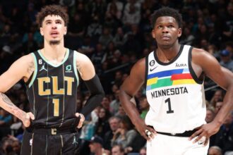 MINNEAPOLIS, MN - FEBRUARY 24: LaMelo Ball #1 of the Charlotte Hornets and Anthony Edwards #1 of the Minnesota Timberwolves look on during the game on February 24, 2023 at Target Center in Minneapolis, Minnesota. (Photo by David Sherman/NBAE via Getty Images)
