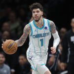 Mar 31, 2026; Brooklyn, New York, USA; Charlotte Hornets guard LaMelo Ball (1) brings the ball up court against the Brooklyn Nets during the third quarter at Barclays Center. Mandatory Credit: Brad Penner-Imagn Images