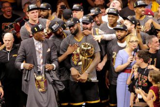 Cleveland Cavaliers forward LeBron James (23) celebrates with the Larry O'Brien Championship Trophy after beating the Golden State Warriors in game seven of the NBA Finals at Oracle Arena.