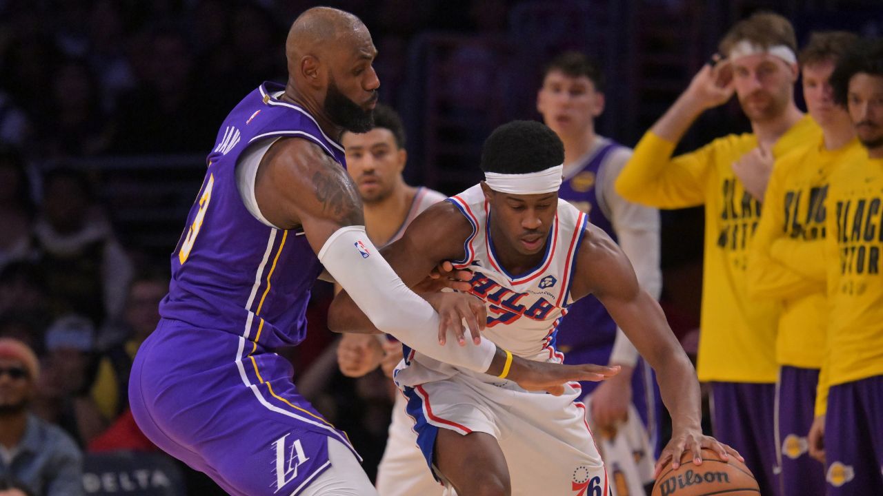 Feb 5, 2026; Los Angeles, California, USA; Los Angeles Lakers forward LeBron James (23) defends Philadelphia 76ers guard Vj Edgecombe (77) in the second half at Crypto.com Arena. Mandatory Credit: Jayne Kamin-Oncea-Imagn Images