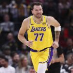 Mar 16, 2026; Houston, Texas, USA; Los Angeles Lakers guard Luka Doncic (77) reacts after scoring a basket during the first quarter against the Houston Rockets at Toyota Center. Mandatory Credit: Troy Taormina-Imagn Images