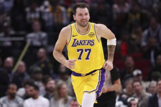 Mar 16, 2026; Houston, Texas, USA; Los Angeles Lakers guard Luka Doncic (77) reacts after scoring a basket during the first quarter against the Houston Rockets at Toyota Center. Mandatory Credit: Troy Taormina-Imagn Images