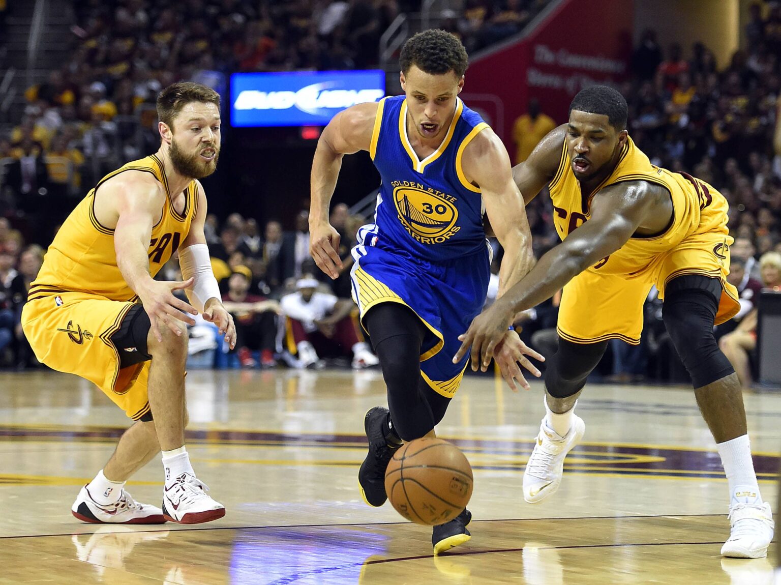 Jun 11, 2015; Cleveland, OH, USA; Golden State Warriors guard Stephen Curry (30) drives to the basket against Cleveland Cavaliers guard Matthew Dellavedova (8) and center Tristan Thompson (13) during the first quarter in game four of the NBA Finals at Quicken Loans Arena. Mandatory Credit: Bob Donnan-USA TODAY Sports