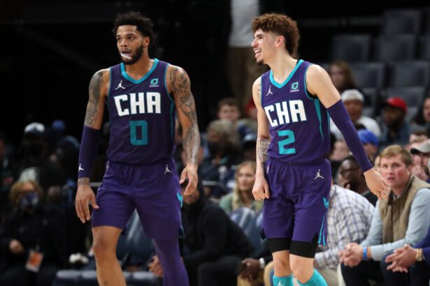 Charlotte Hornets guard LaMelo Ball (2) and Charlotte Hornets forward Miles Bridges (0) wait for play to resume during the second half against the Memphis Grizzles at FedExForum.