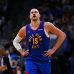 Apr 20, 2026; Denver, Colorado, USA; Denver Nuggets center Nikola Jokic (15) reacts in the second half against the Minnesota Timberwolves during game two of the first round of the 2026 NBA Playoffs at Ball Arena. Mandatory Credit: Ron Chenoy-Imagn Images