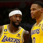 LOS ANGELES, CALIF. - NOV. 9, 2022. Laker guards Patrick Beverley, left, and Russell Westbrook talk during a break in the action of the game against the Clippers at Crypto.com Arena in Los Angeles on Wednesday night, Nov. 9, 2022. (Luis Sinco / Los Angeles Times via Getty Images)