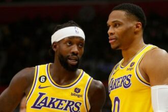 LOS ANGELES, CALIF. - NOV. 9, 2022. Laker guards Patrick Beverley, left, and Russell Westbrook talk during a break in the action of the game against the Clippers at Crypto.com Arena in Los Angeles on Wednesday night, Nov. 9, 2022. (Luis Sinco / Los Angeles Times via Getty Images)