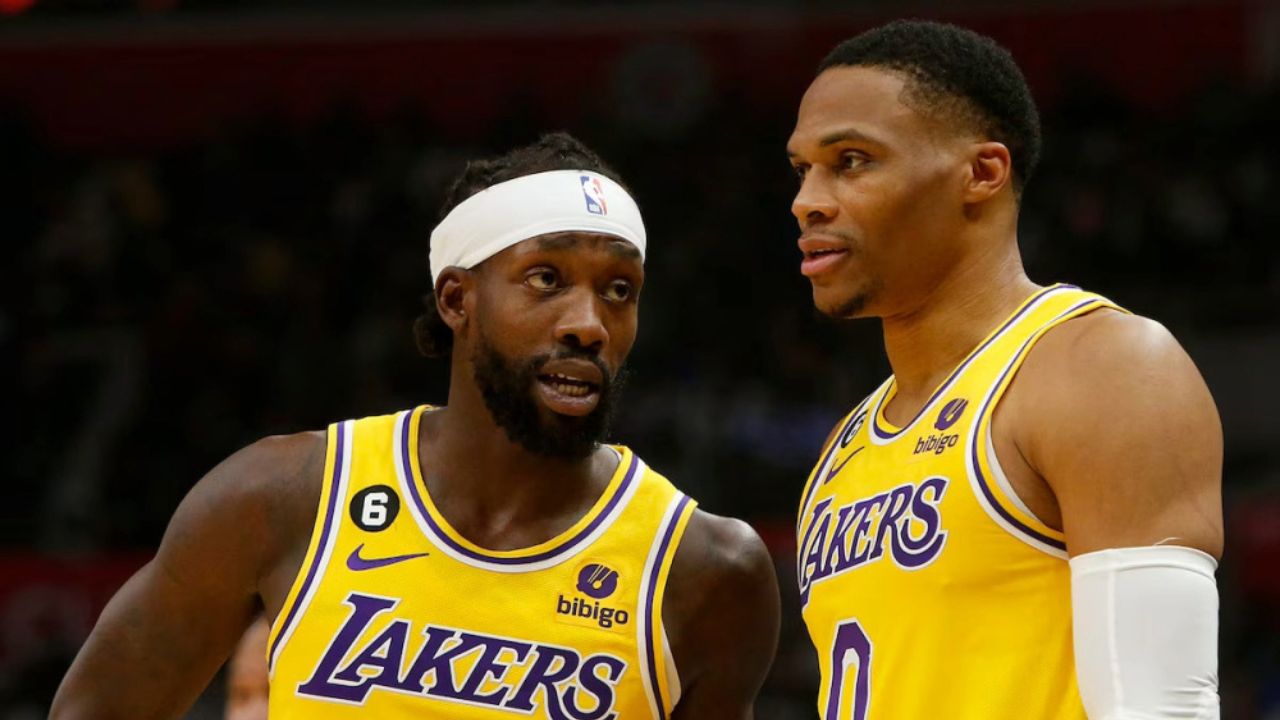 LOS ANGELES, CALIF. - NOV. 9, 2022. Laker guards Patrick Beverley, left, and Russell Westbrook talk during a break in the action of the game against the Clippers at Crypto.com Arena in Los Angeles on Wednesday night, Nov. 9, 2022. (Luis Sinco / Los Angeles Times via Getty Images)