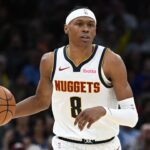 CLEVELAND, OH - JANUARY 2: Peyton Watson #8 of the Denver Nuggets dribbles the ball during the game against the Cleveland Cavaliers on January 2, 2026 at Rocket Arena in Cleveland, Ohio. (Photo by Brian Kolin/NBAE via Getty Images)