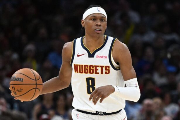 CLEVELAND, OH - JANUARY 2: Peyton Watson #8 of the Denver Nuggets dribbles the ball during the game against the Cleveland Cavaliers on January 2, 2026 at Rocket Arena in Cleveland, Ohio. (Photo by Brian Kolin/NBAE via Getty Images)