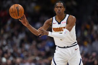 Jan 29, 2026; Denver, Colorado, USA; Denver Nuggets guard Peyton Watson (8) passes the ball in the first quarter against the Brooklyn Nets at Ball Arena. Mandatory Credit: Ron Chenoy-Imagn Images
